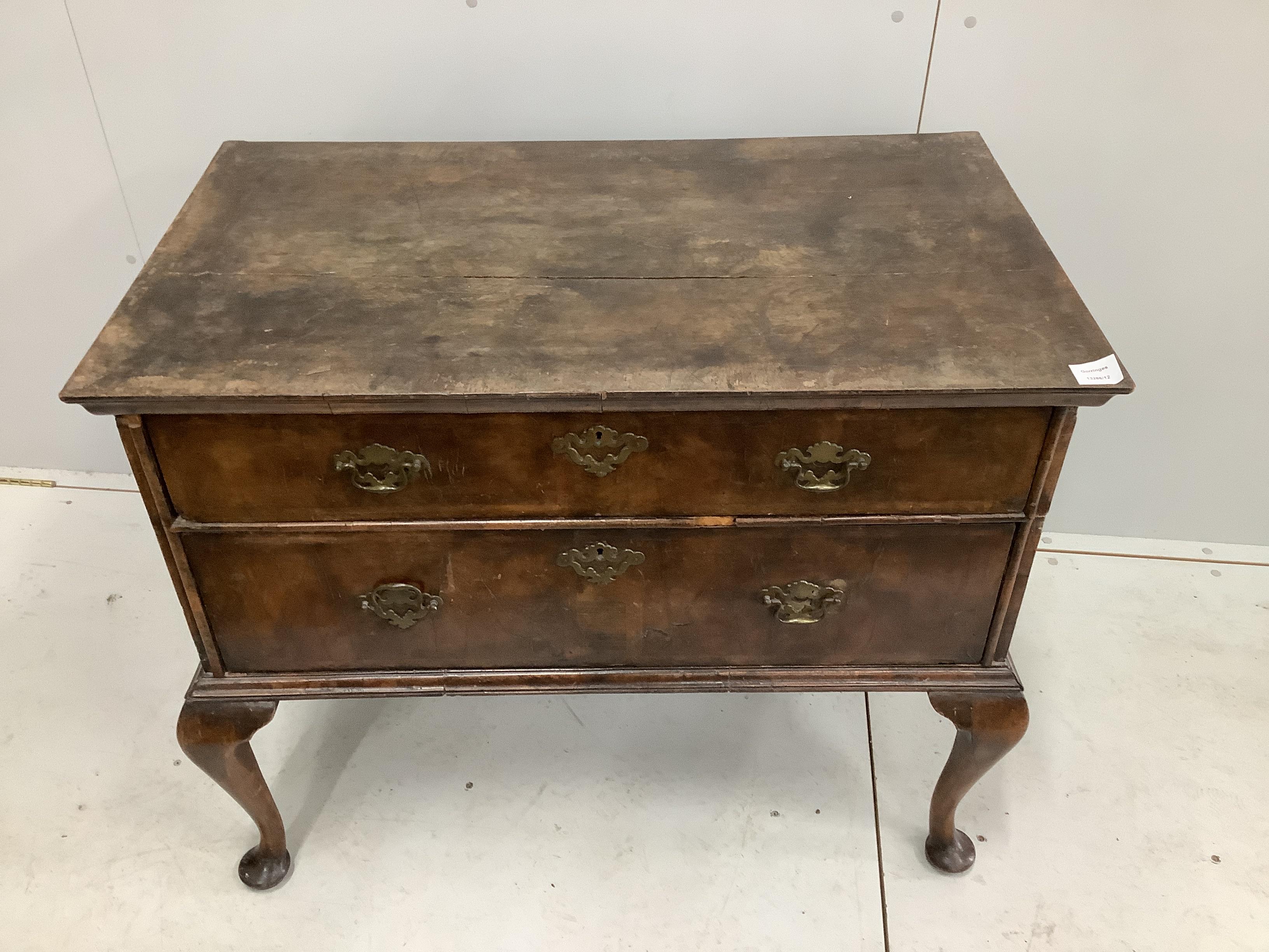 A Queen Anne banded walnut two drawer chest, adapted from a stand, width 96cm, depth 56cm, height 80cm. Condition - poor